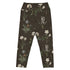 Wild At Hort Capri Swim Leggings featuring Deep dark brown background with precise, luminous white botanical specimen illustrations including a delicate dandelion seed head, in a hushed and contemplative style, women’s capri swim leggings