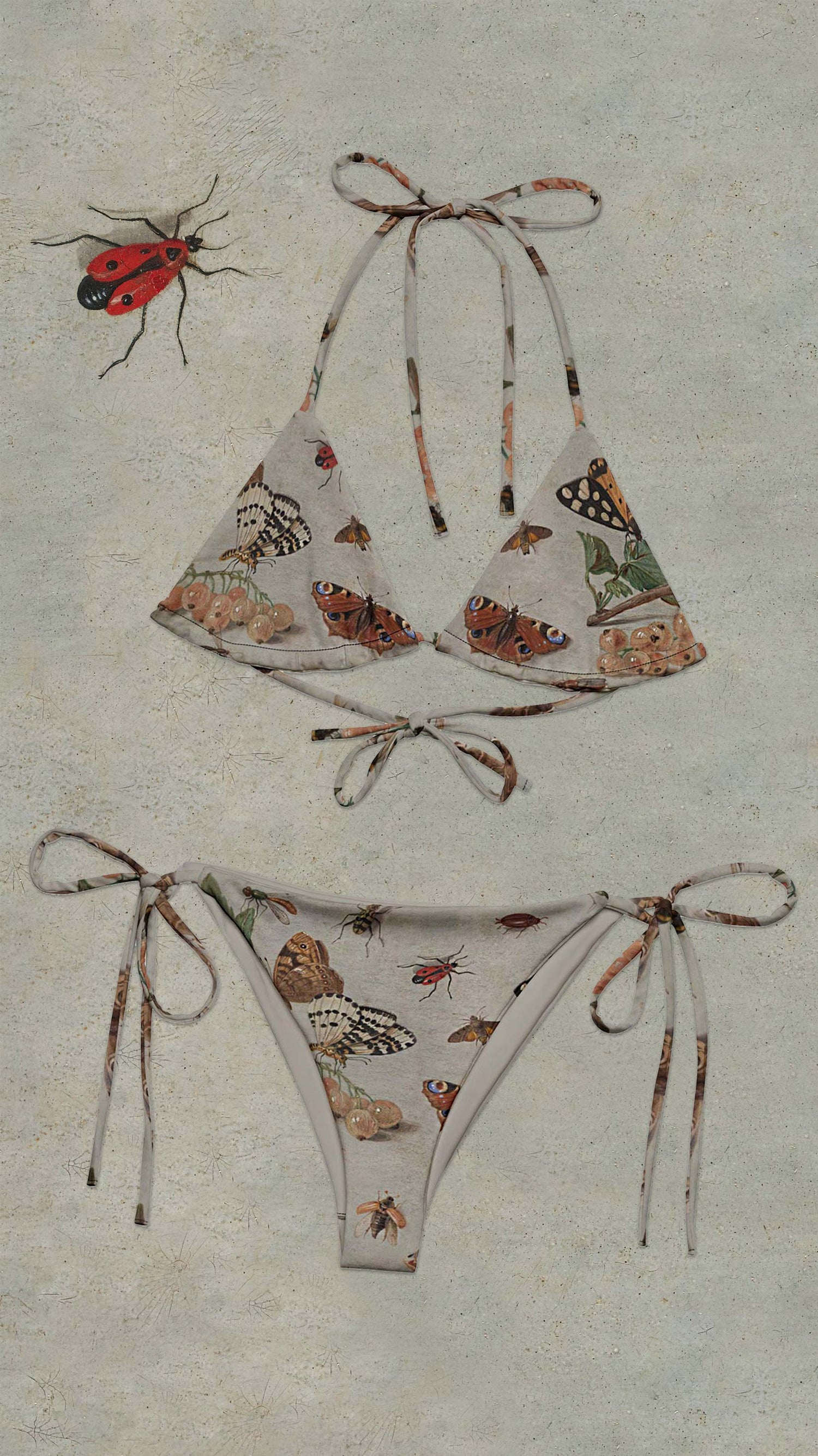 Butterfly-patterned bikini set on a textured beige background with a red insect.