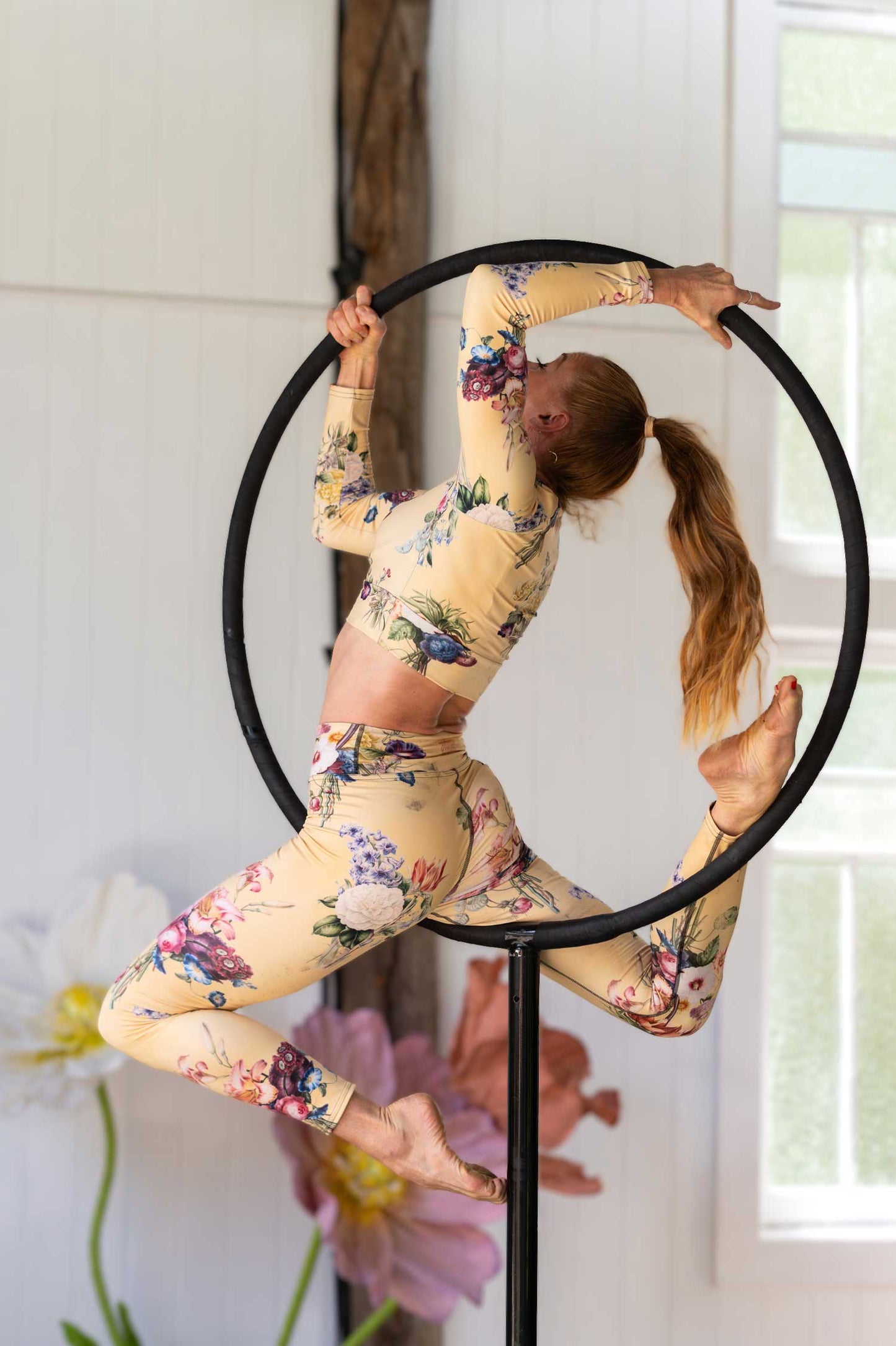 Circus performer wearing Splash'd floral rash guard at the A Floral Affair launch event